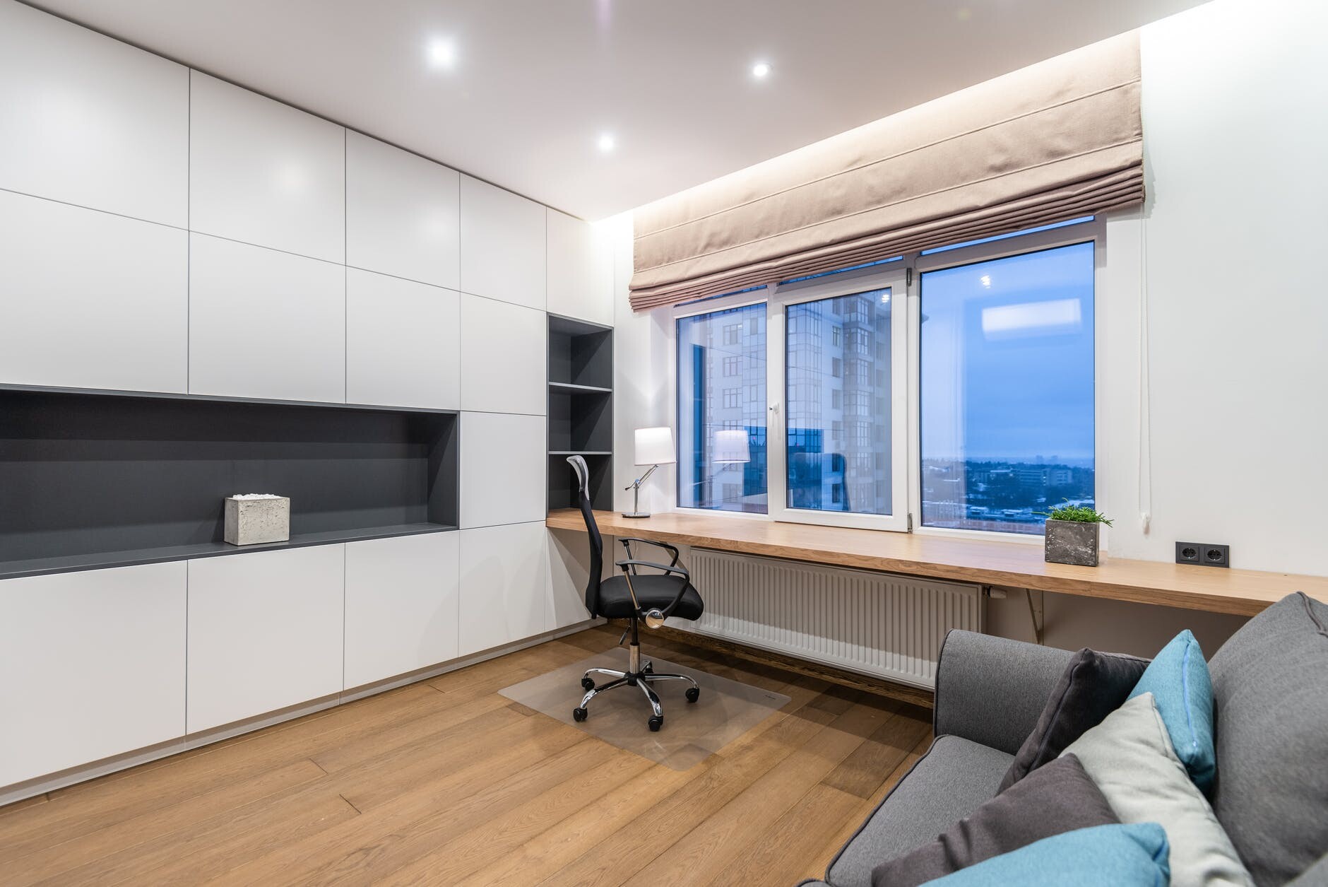 modern room with couch and cupboard