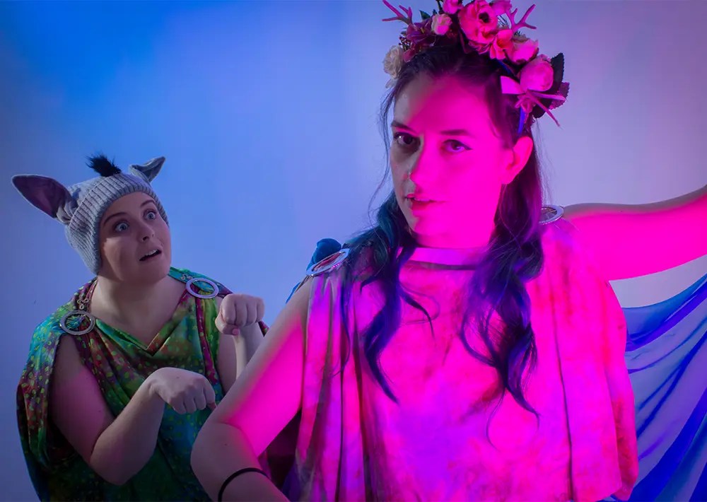 School Pantomimes and Theatre in Education : Freya from A Viking's Tale stood before a backdrop depicting a brief history of time.