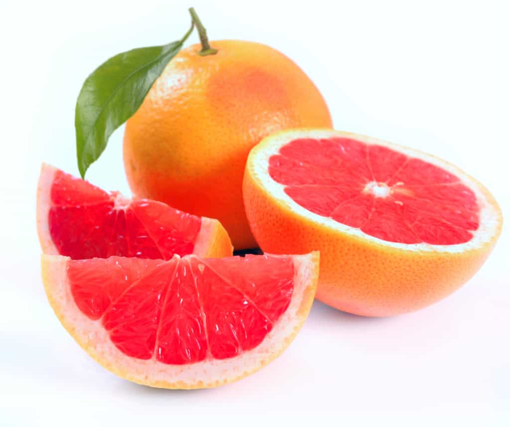 Grapefruit with segments on a white background