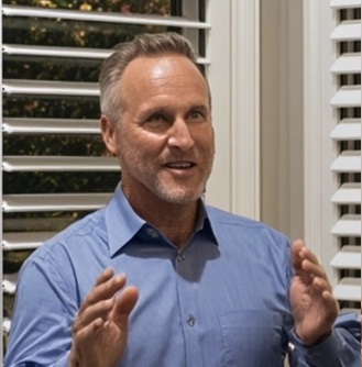 Mr Whelan stood in front of window shutters