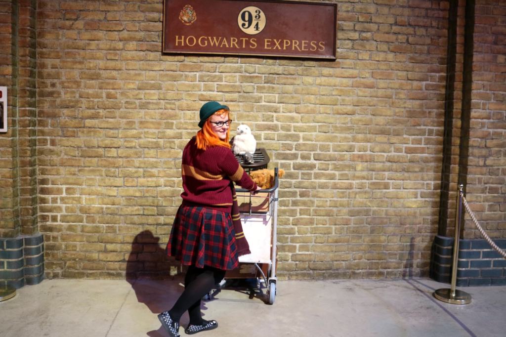 Kariss at Platform 9 3/4's at Warner Bros Studio Tour in Watford, a Harry Potter Location in the UK