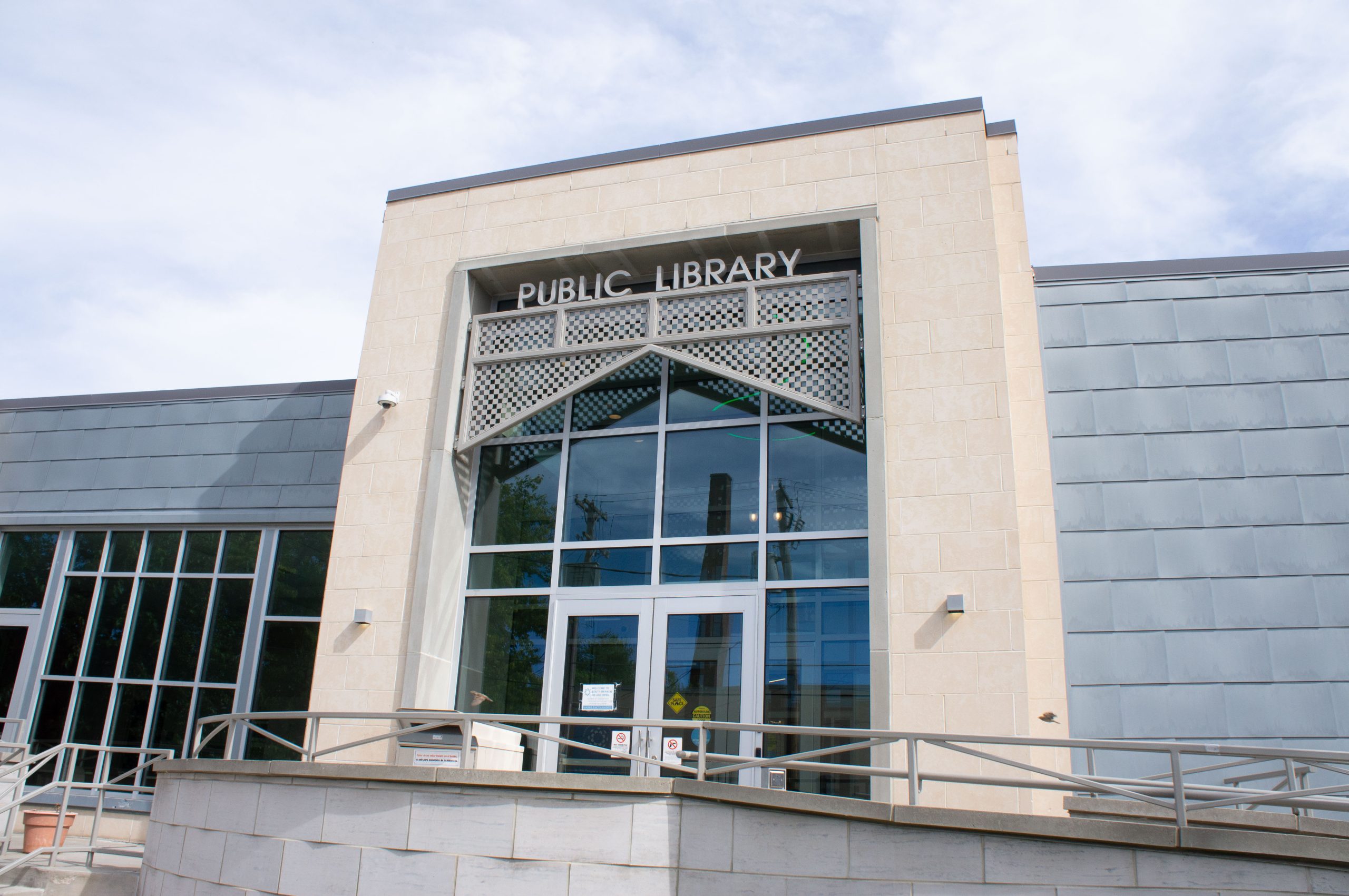 The beige brick and glass main entrance to the the South Library Branch of the Cleveland Public Library.