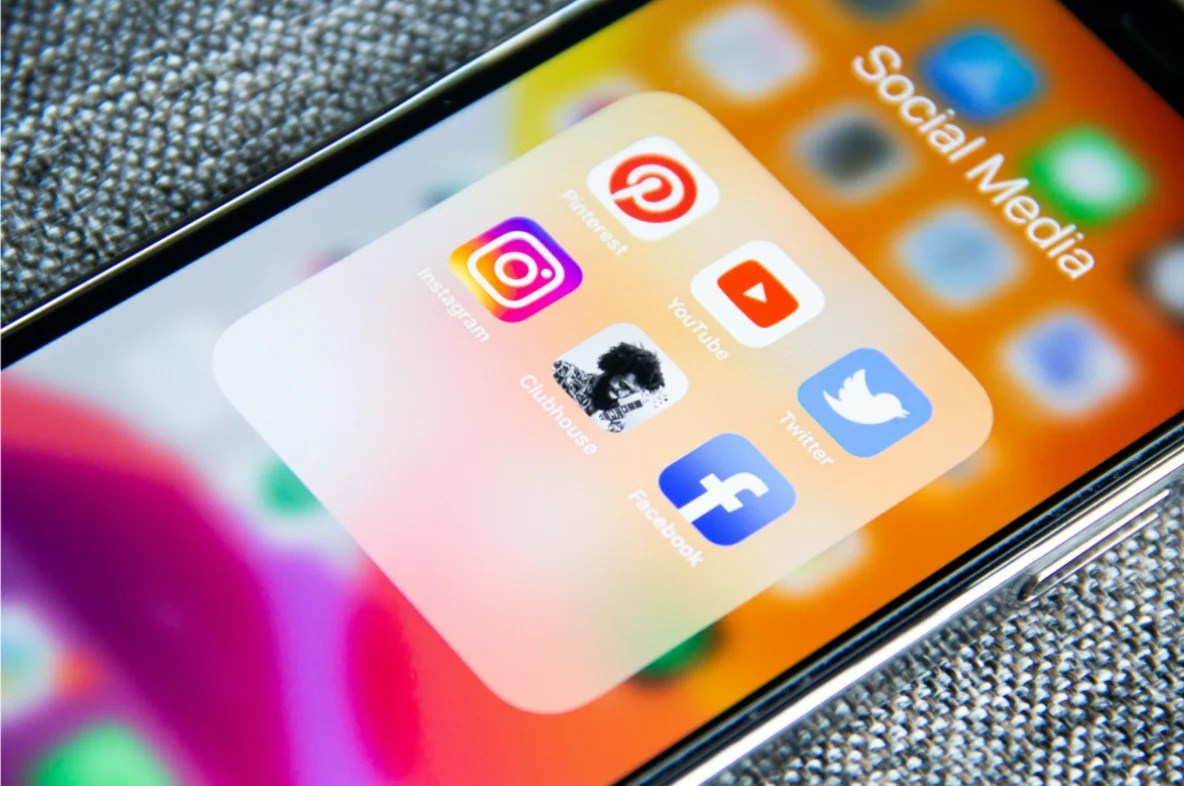 Image of a phone with social media platforms in a folder