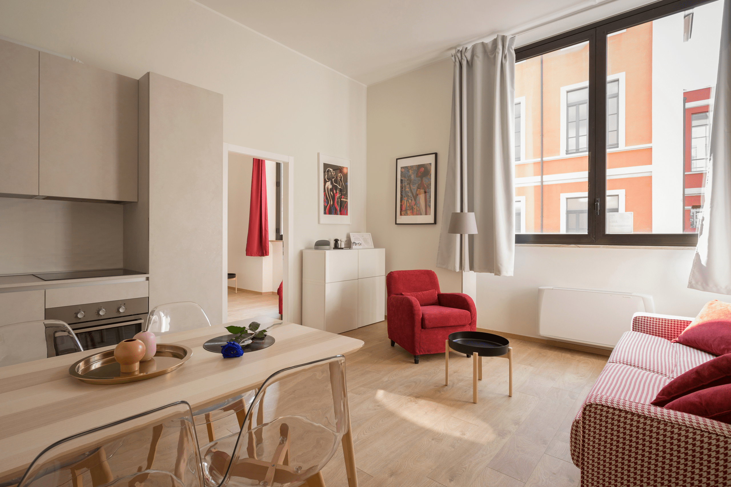 Image of a modern living room with all the essentials and a window to the right