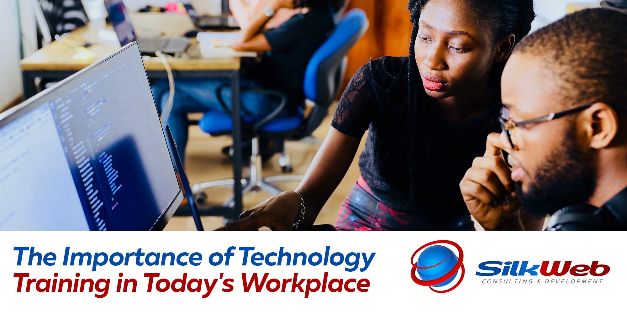 Two professionals collaborate at a computer screen displaying lines of code, discussing technology-related work in a modern office setting. Below the image, a banner reads "The Importance of Technology Training in Today’s Workplace," alongside the SilkWeb Consulting & Development logo.