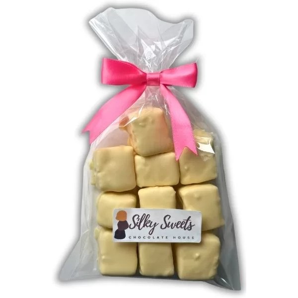 clear cellophane bag measuring 6x10in with 10 white chocolate -covered marshmallows with a store label on the front that says silky sweets chocolate house and a pink bow to tie the bag