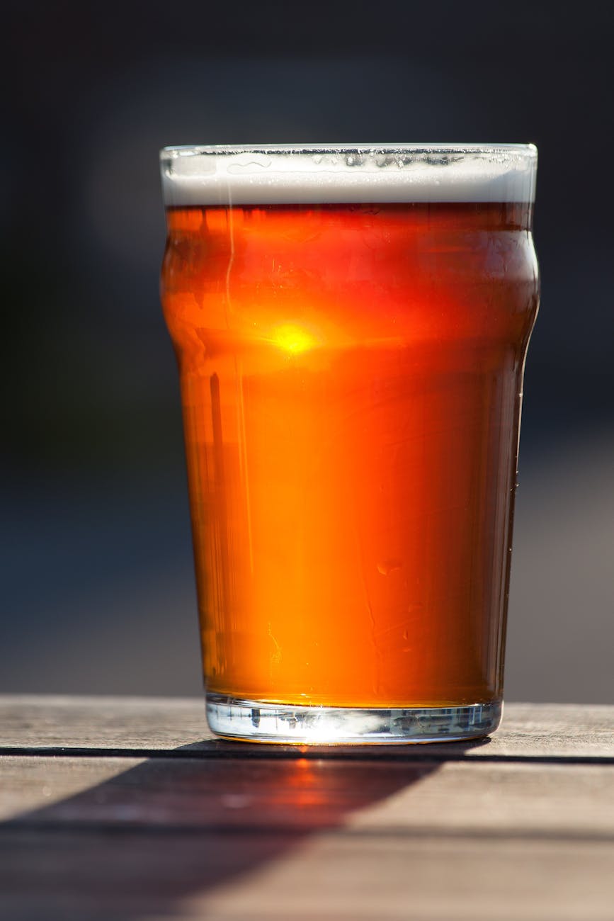 red beverage in clear drinking glass