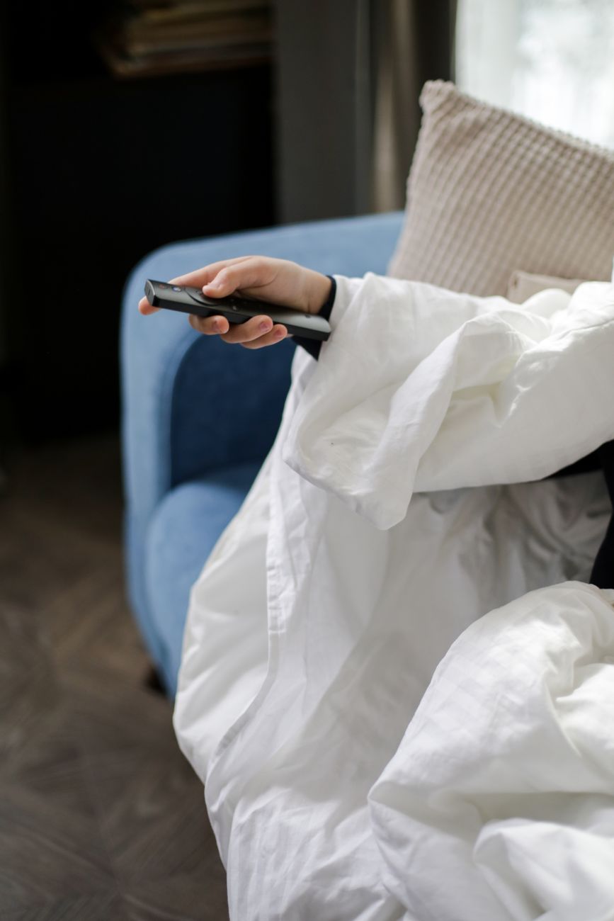 a person holding a remote