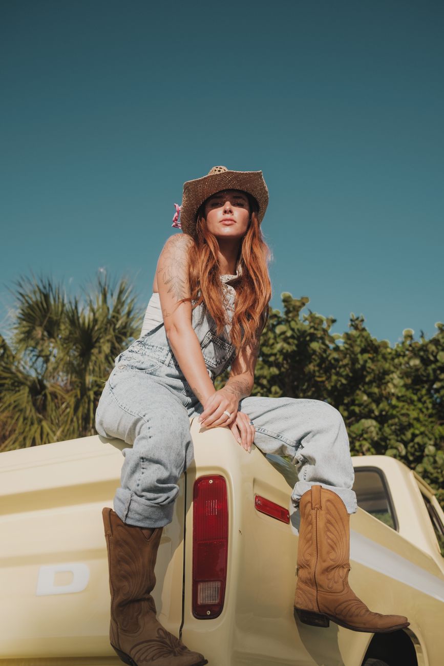 model posing in overalls
