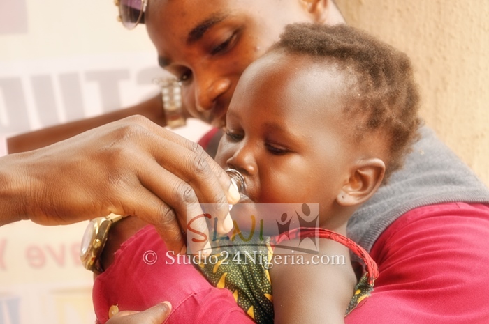 a child being dewormed during one of SLNI's community programs