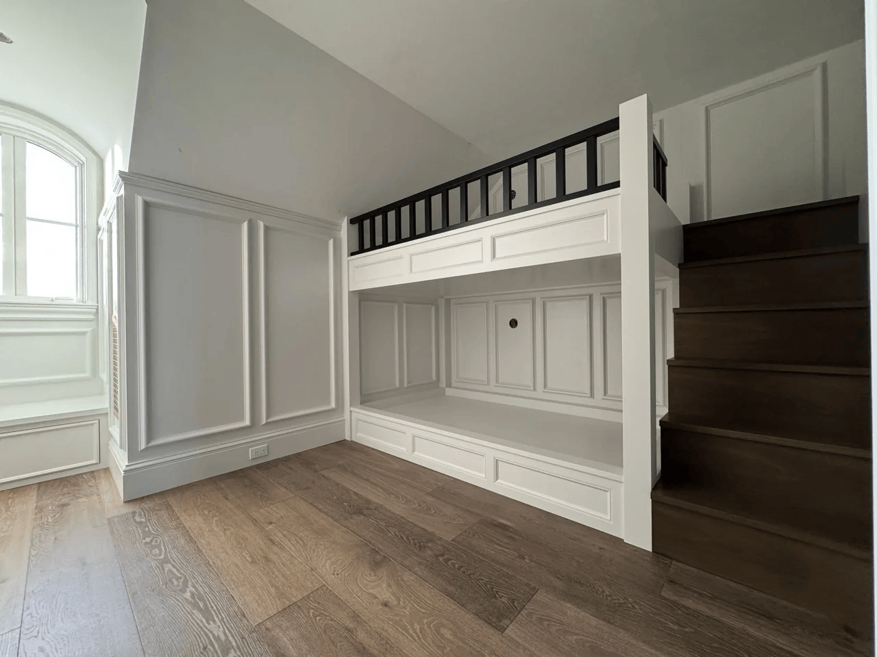 High-end millwork installation with custom wall paneling and built-in architectural woodwork