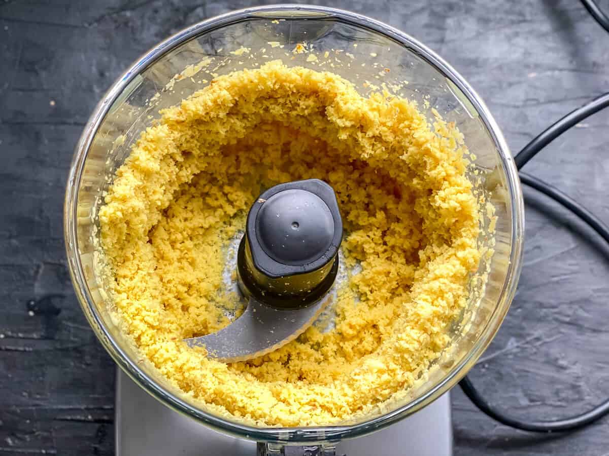 A food processor with a homemade paste inside.