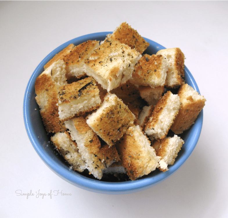 Homemade croutons in blue bowl