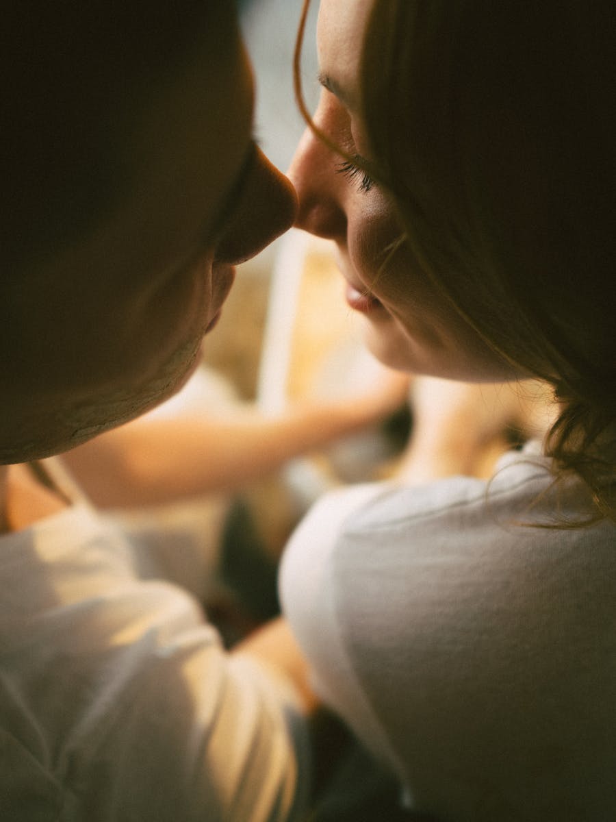Intimate close-up shot of a couple sharing a romantic and loving moment together.