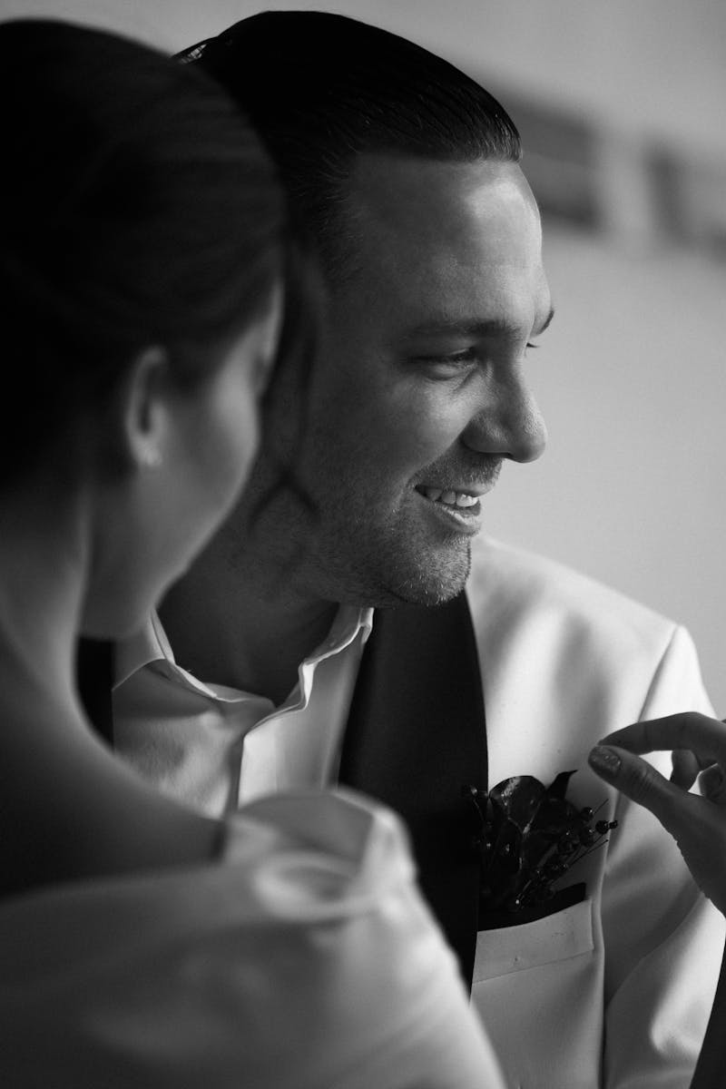 Classic black and white portrait of a joyful couple at their wedding.