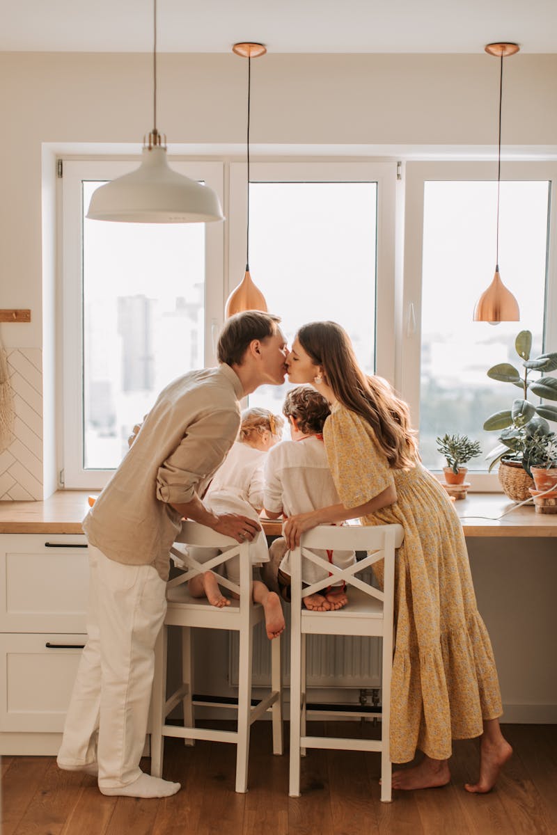 A joyful family shares a tender moment together, capturing love and unity.
