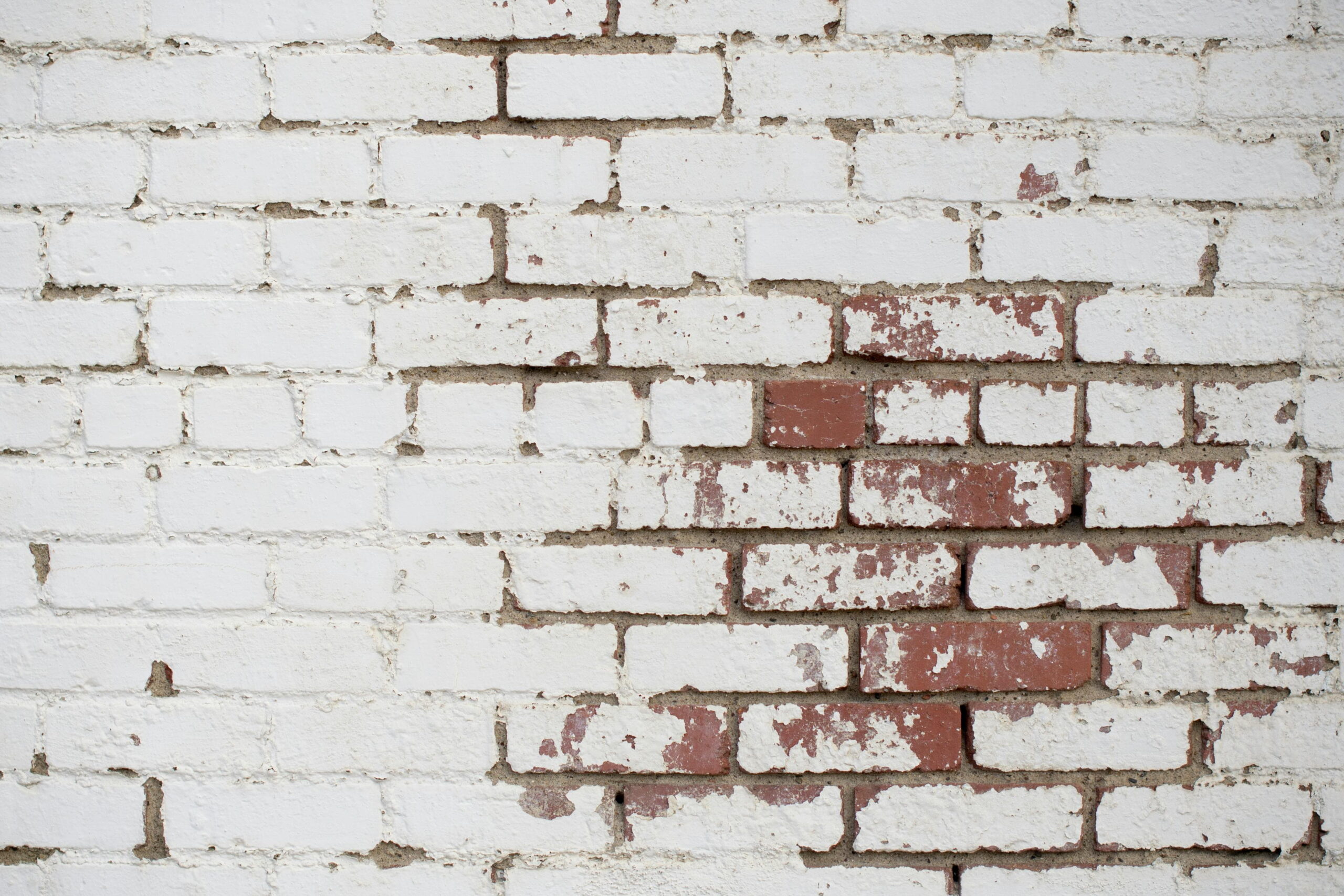Weathered brick wall showcasing the need for waterproofing services in Barnslis