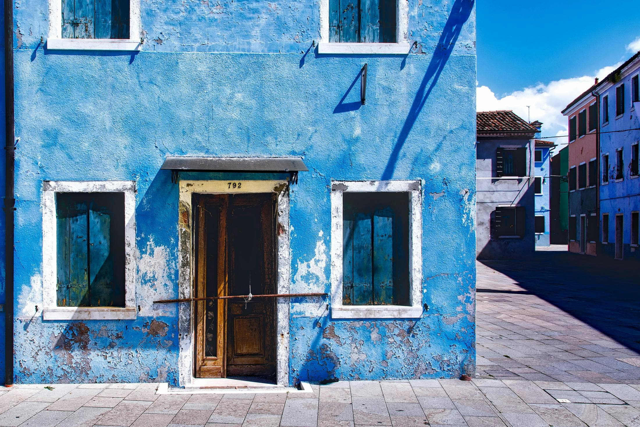 weathered blue rendered garage facade estimating materials for a garage render