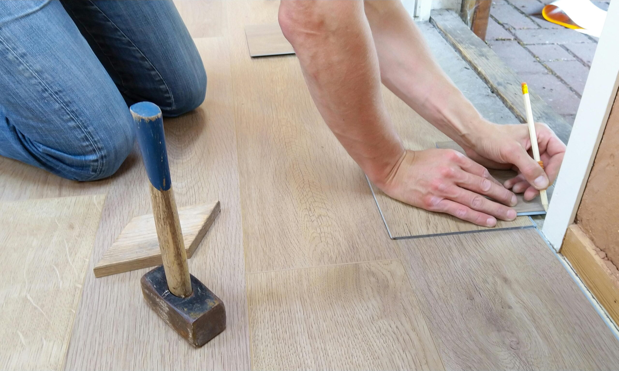 Blue Dolphin masking tape uses in protecting laminate flooring edges during rendering and plastering
