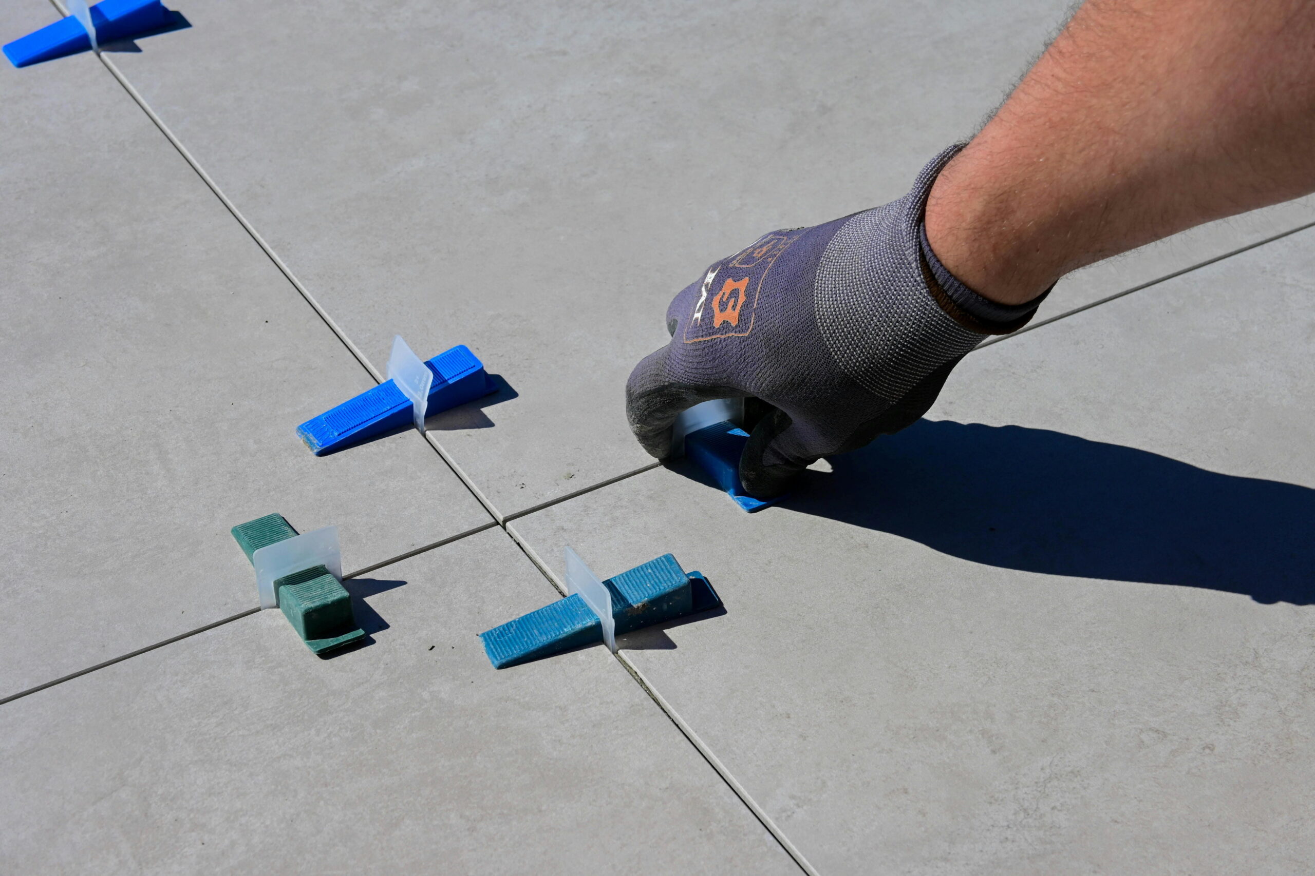 Tile installation using spacer leveling clips to meet Part L building regs for insulation 2025