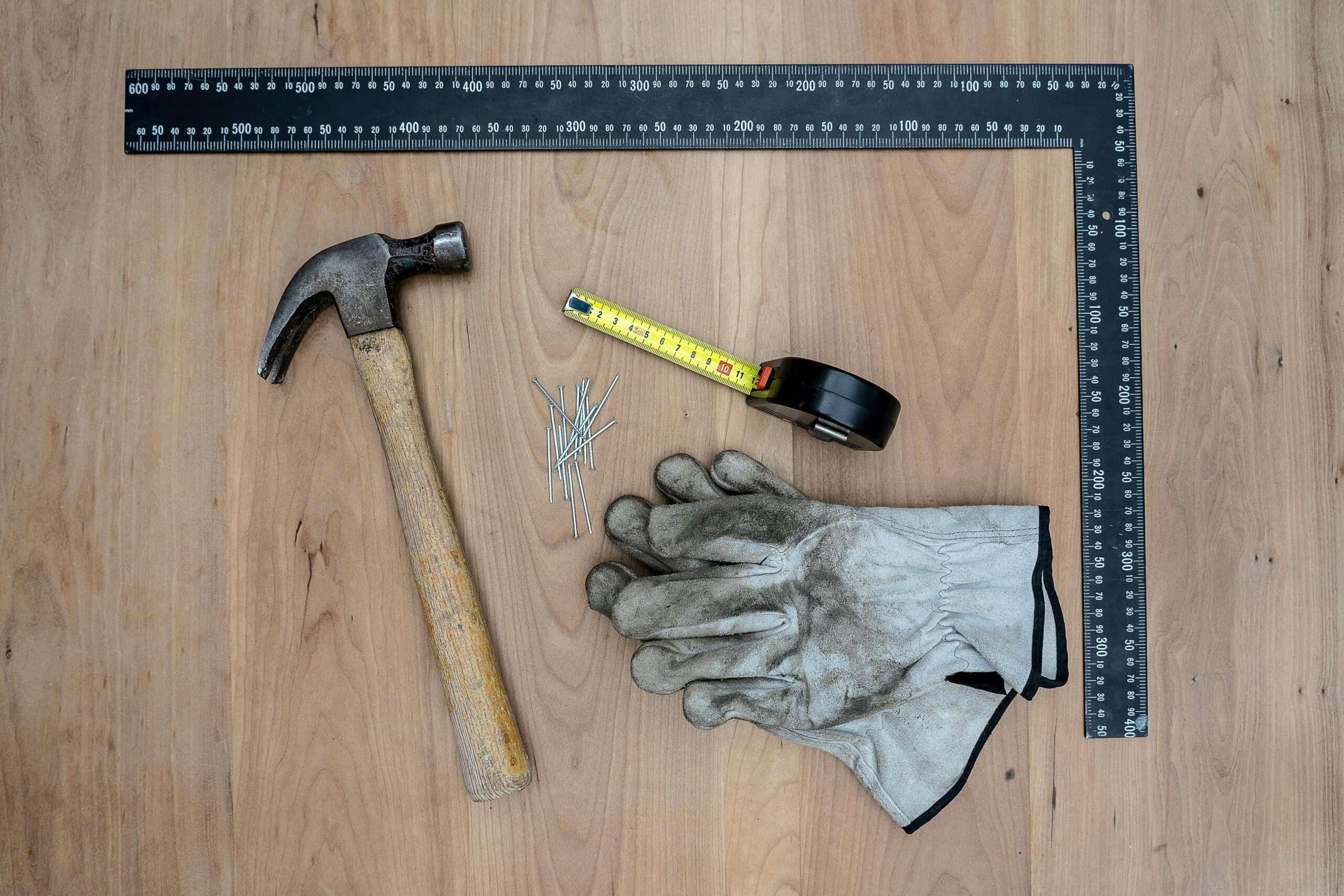monocouche vs silicone render pros and cons rendering tools including hammer, nails, tape measure and gloves