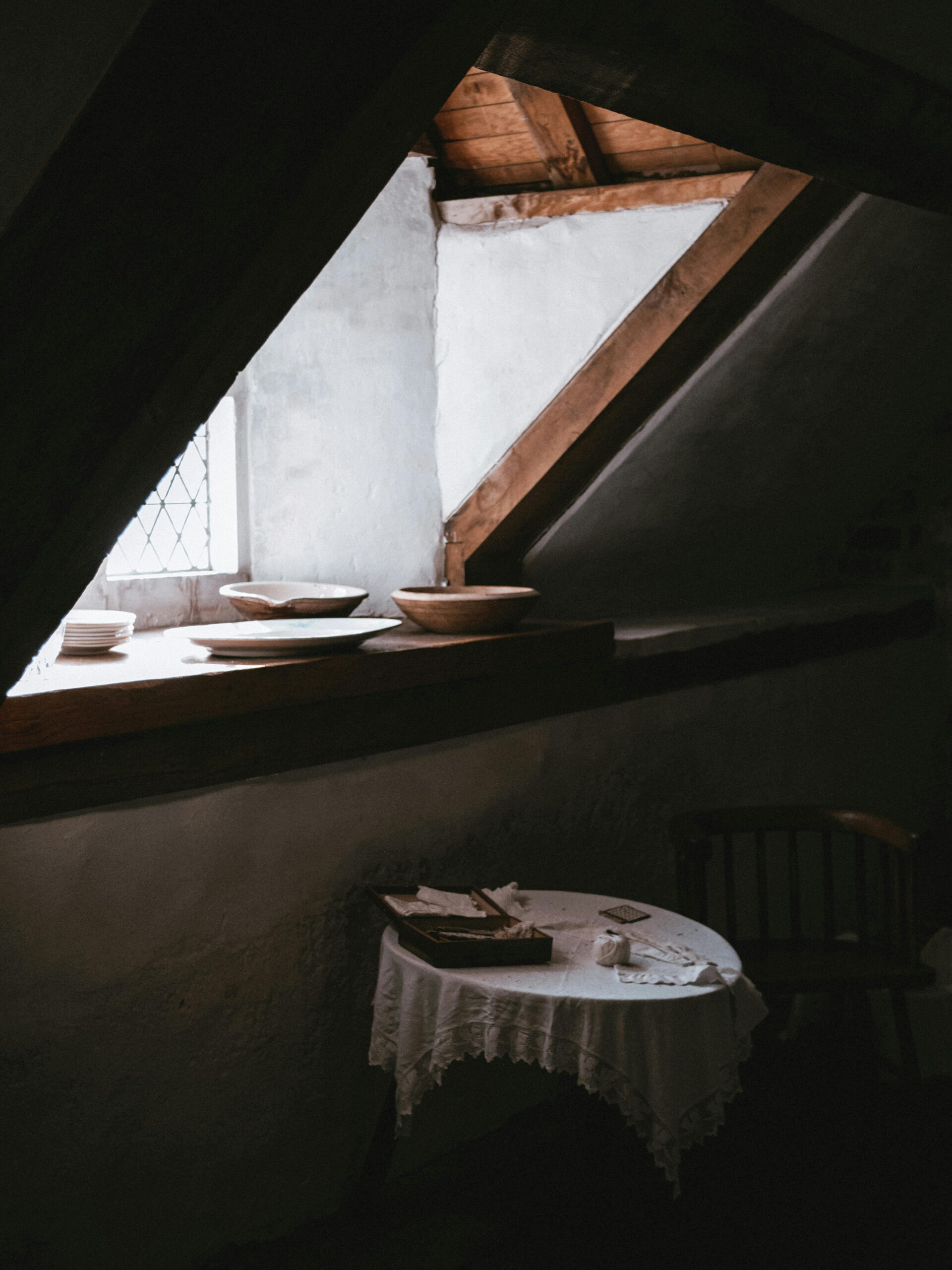 Cozy attic interior showcasing the benefits of sealing external cracks before winter with professional rendering services from Simple Solution 4 U Ltd