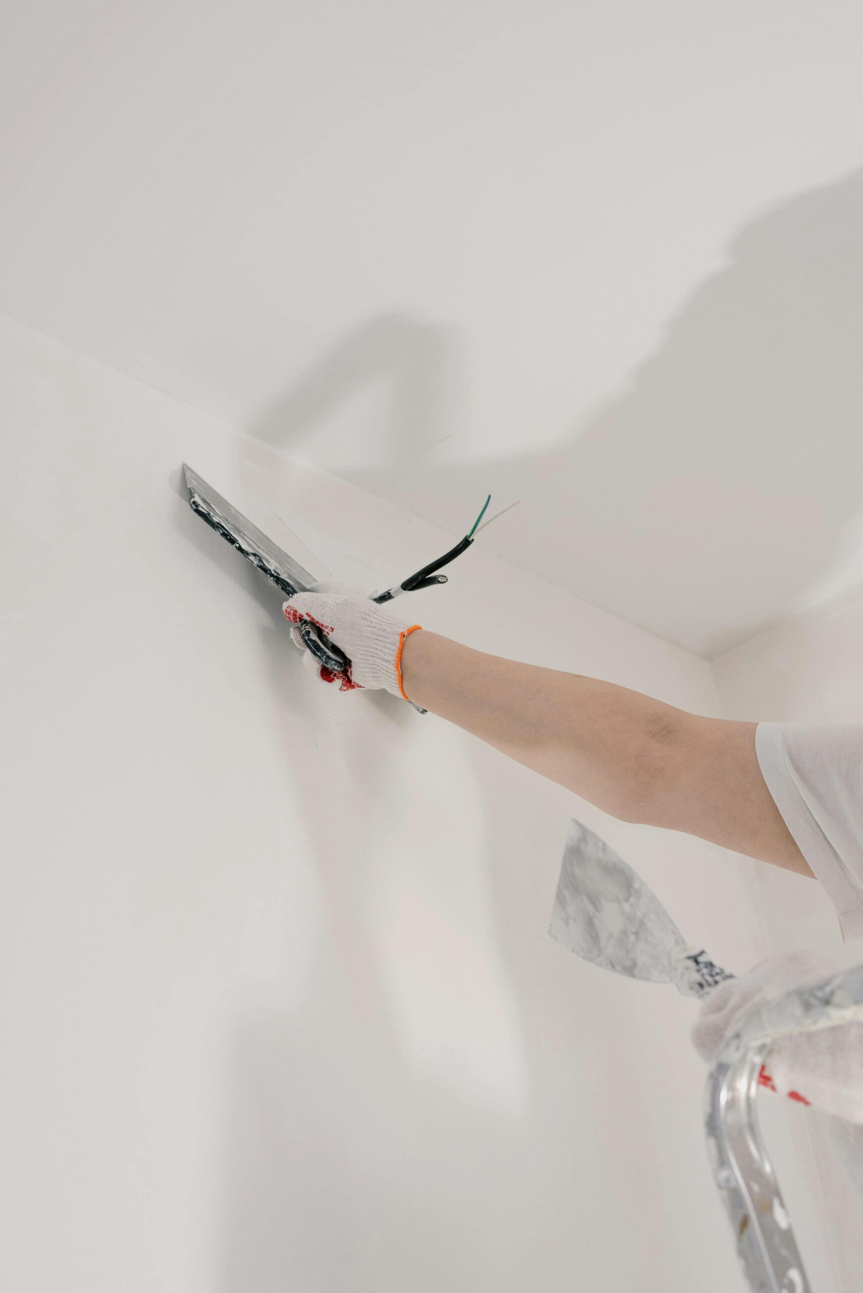 Exterior wall patch repair under 50 with professional plastering tools from Simple Solution 4 U Ltd