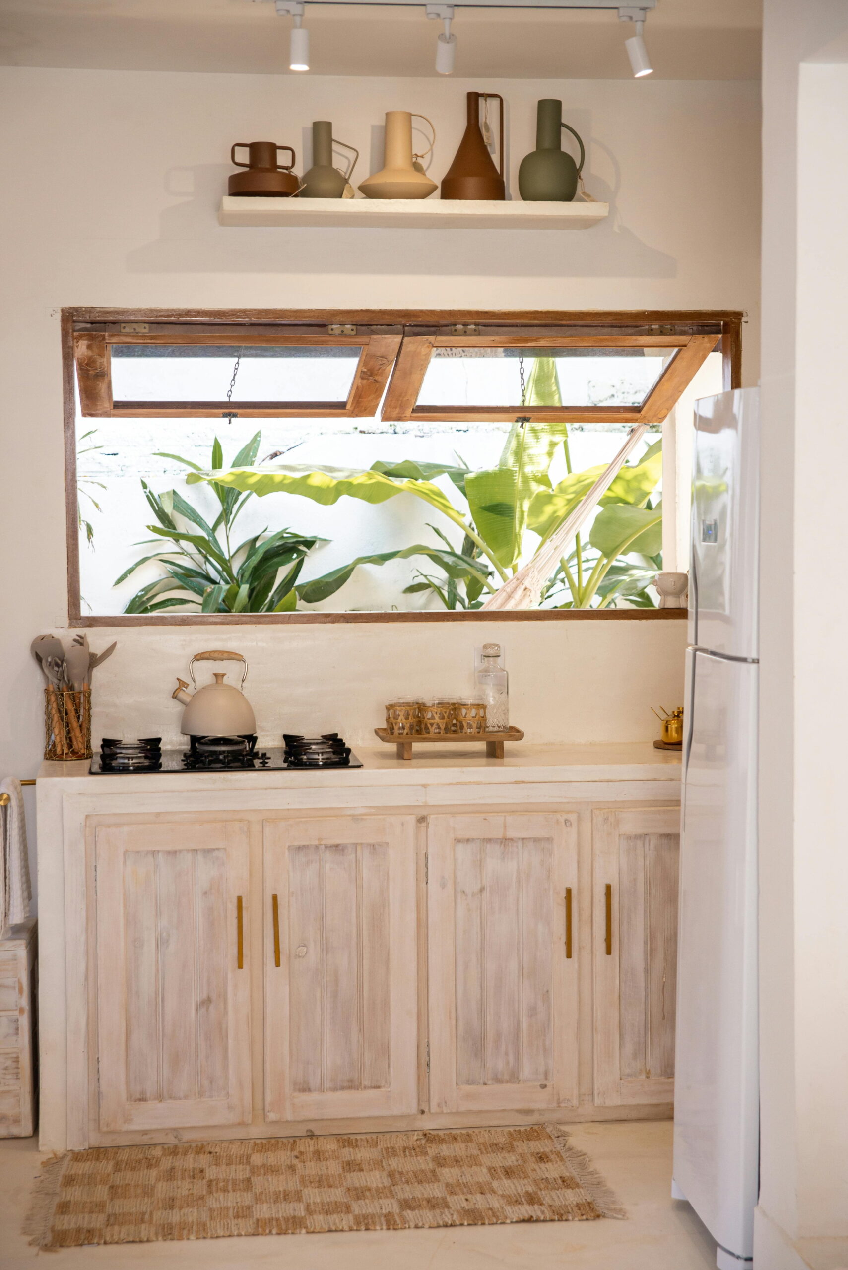 kitchen window installation using self-adhesive window film on rendered exterior wall