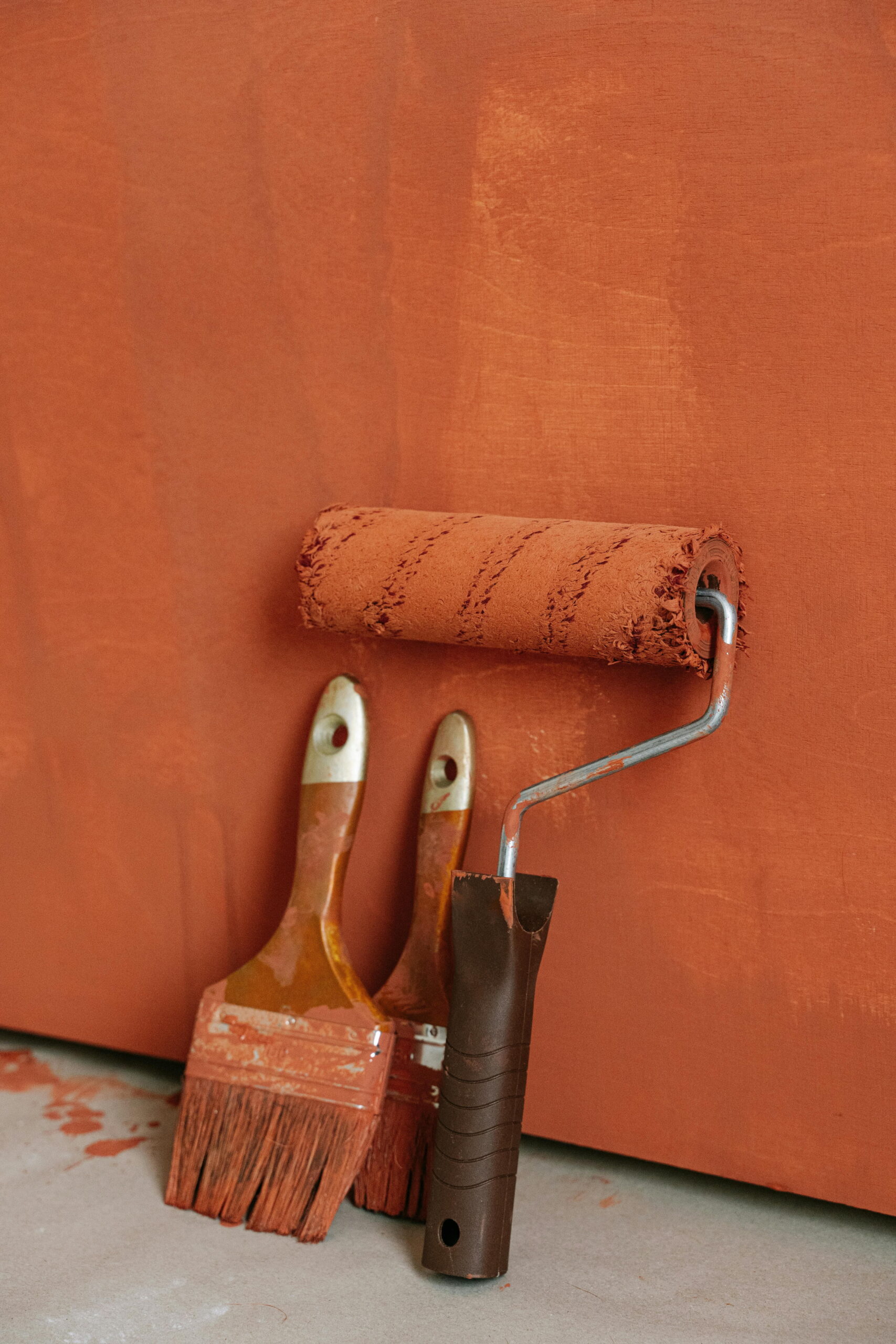 Painting tools including brushes and roller applying render compatible with window cills