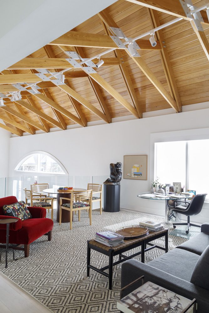 The stunning scissor truss ceiling runs the length of the home, from the living room to the back bedrooms.