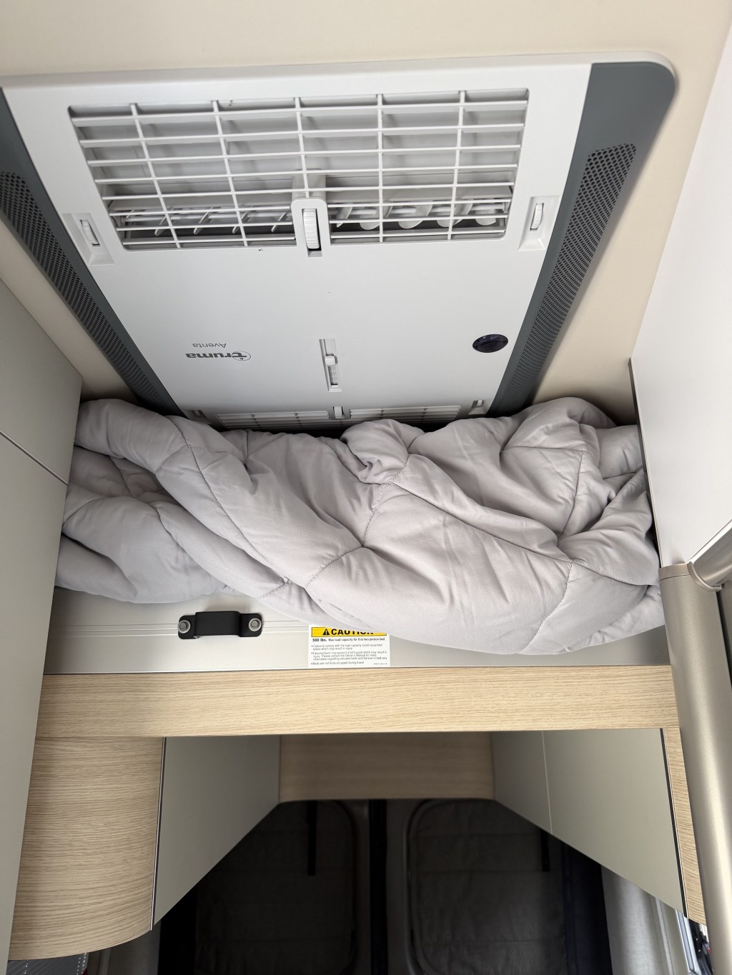 Ceiling AC and lift bed, with storage underneath
