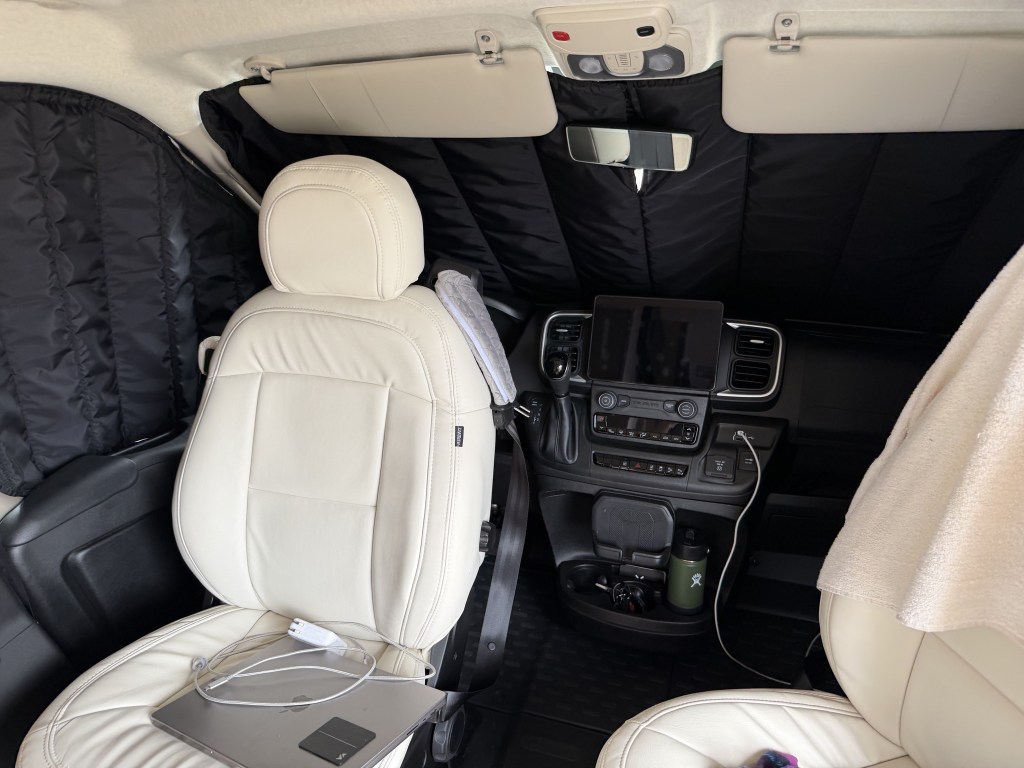 Cab with seats turned around and window covers