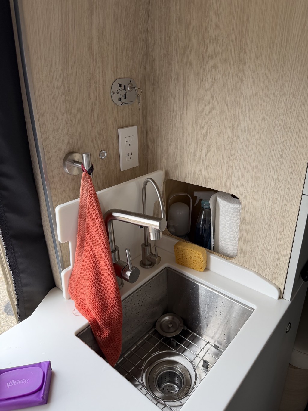 Kitchen sink, water and filtered water faucets; water pump switch, electrical outlet, lift bed buttons