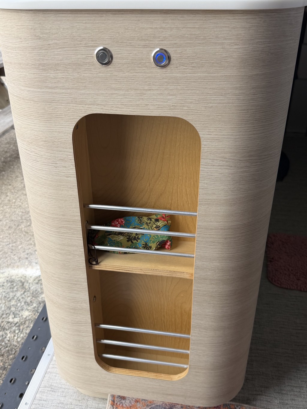 Cubbies next to the sliding door, with light switches