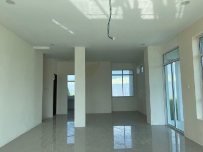 Kitang Heights two storey intermediate terrace house with sub-basement.