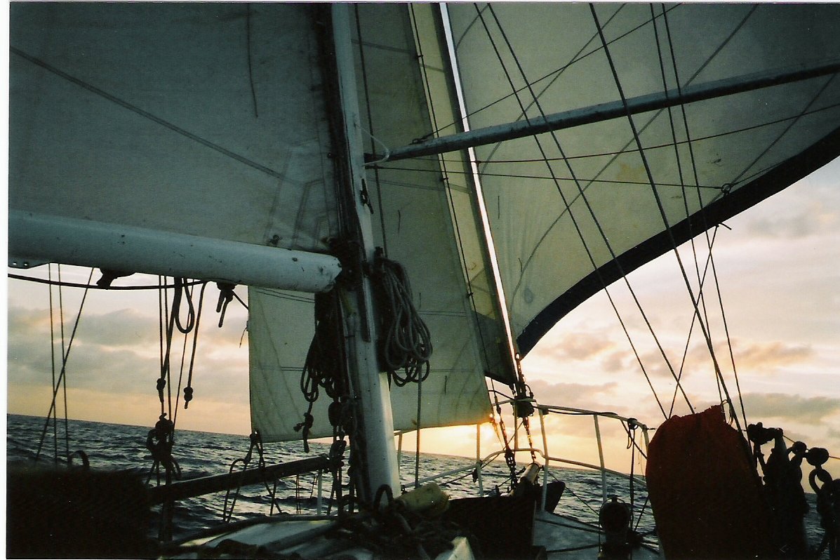 Cruising the high seas - boat with fore sails sailing along