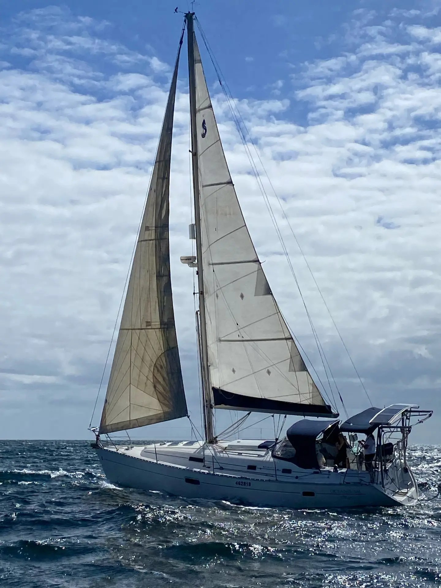 Cruising sailboat sailing offshore under full sail