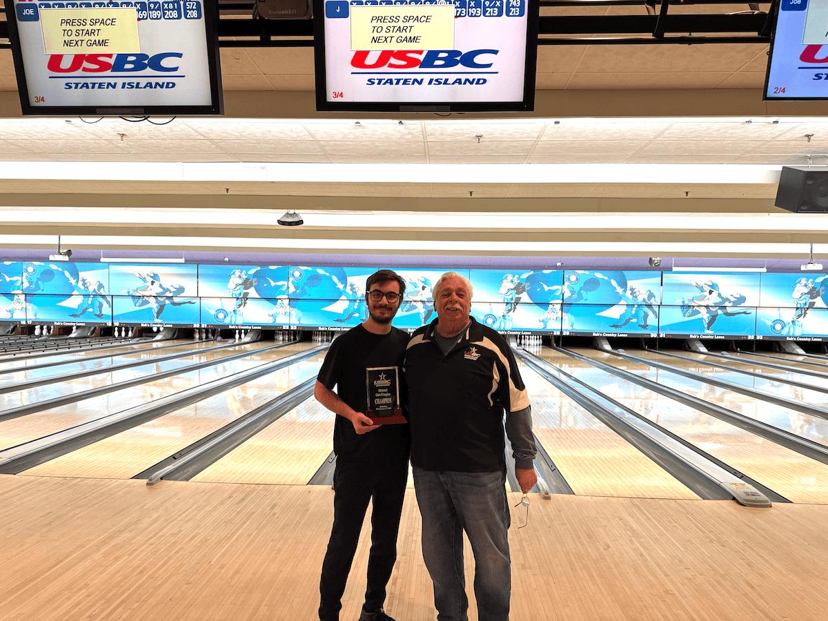Joseph Carrieri pictured with SIUSBC President Jim Episcopia posing with the trophy