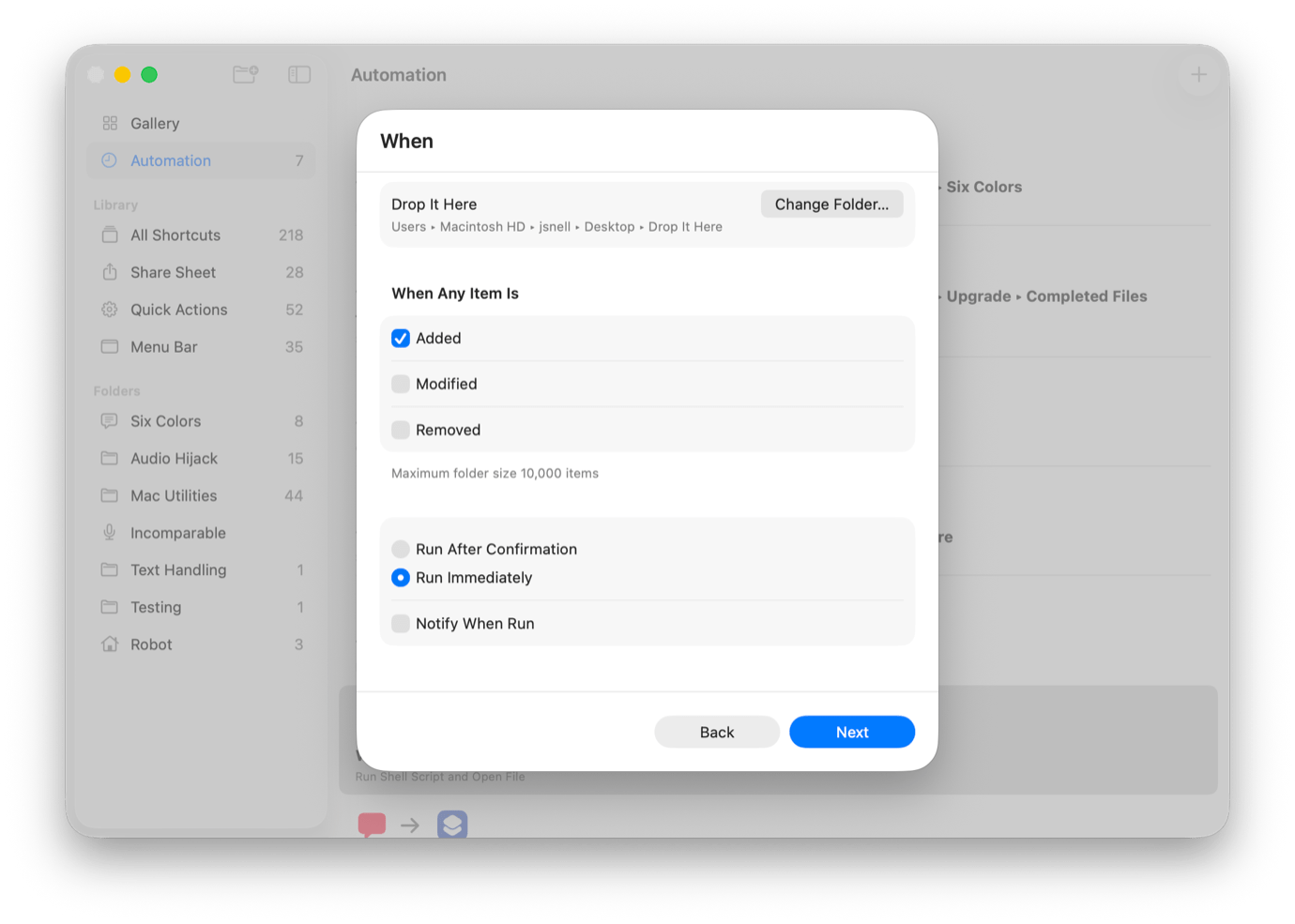 Screenshot of an automation setup on a Mac. Left: 'Gallery' sidebar with folders like 'All Shortcuts.' Right: 'When' section with options to drop items in a folder, trigger actions on 'Added,' 'Modified,' or 'Removed,' and choose run settings. 'Next' button at bottom.