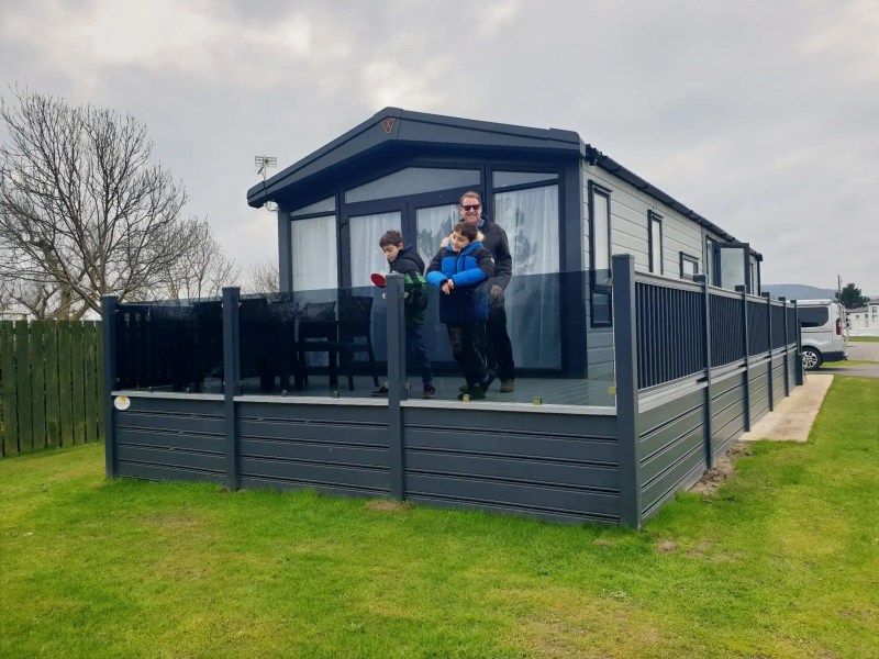 Lodge exterior with family on balcony