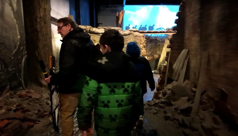 Boys exploring WWI trench exhibit at the Tank Museum
