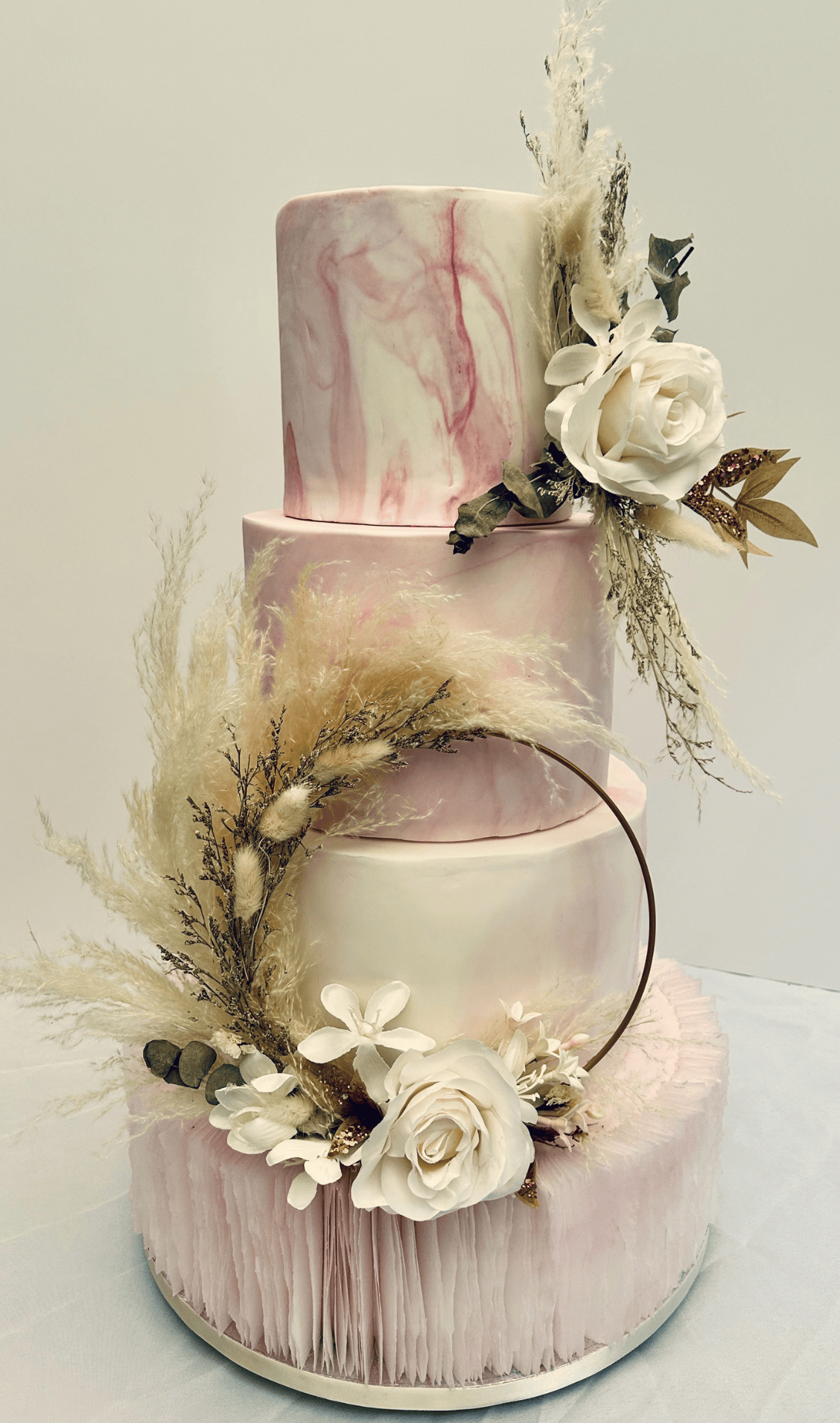 Pink and white cake with floral touches