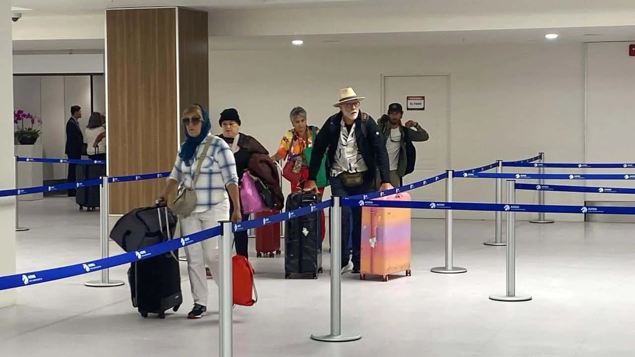 Travelers walking through the new international arrivals area at SJO Airport in San José Costa Rica