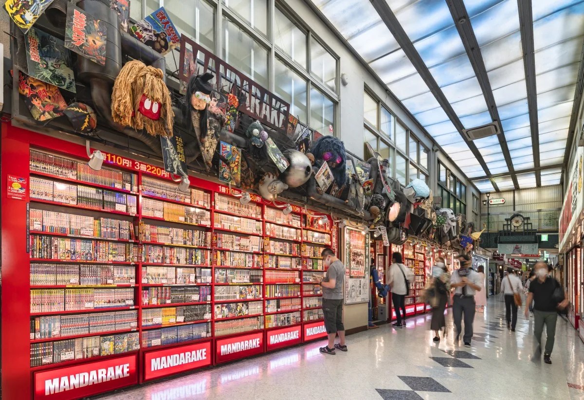 tokyo, japan - august 06 2022: Shelves full of used comics books in sale in the corridor of the Nakano Broadway Shopping Mall famous for its many Mandarake stores specialize in manga and anime-related