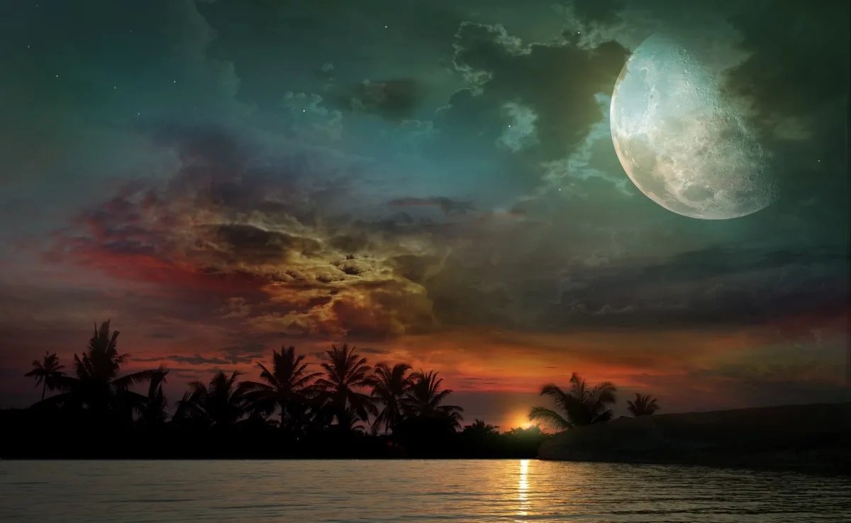 The ocean, sunset and moon