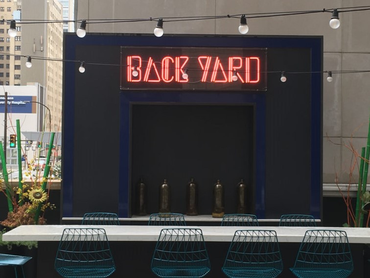 The Back Yard sign at Aloft, Center City makes an inviting back drop
