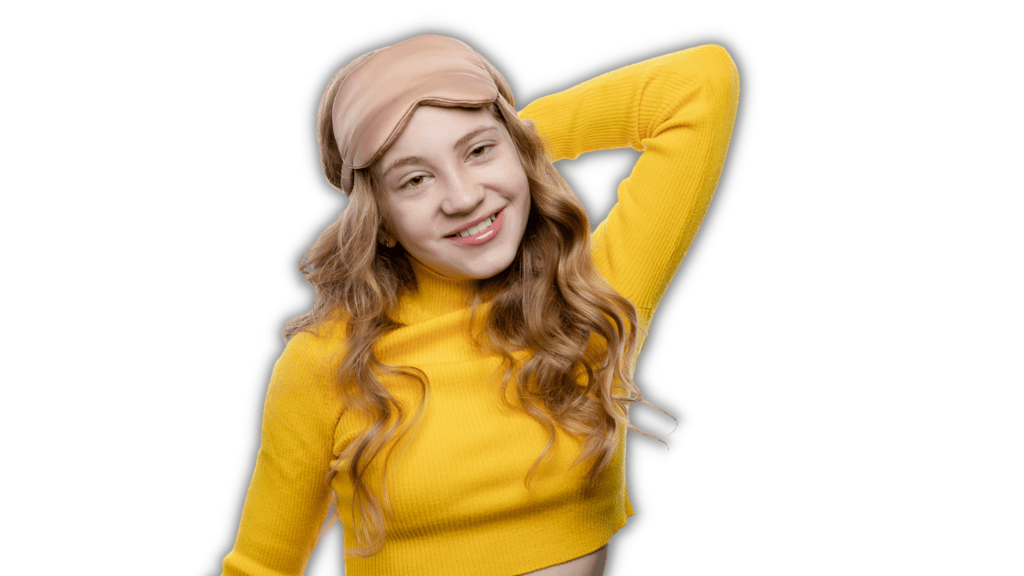 Anastasia, co-founder of Small Bits of Happiness, wearing bright yellow top, she has long blonde curly hair and is wearing a pink sleep mask on her forehead.
