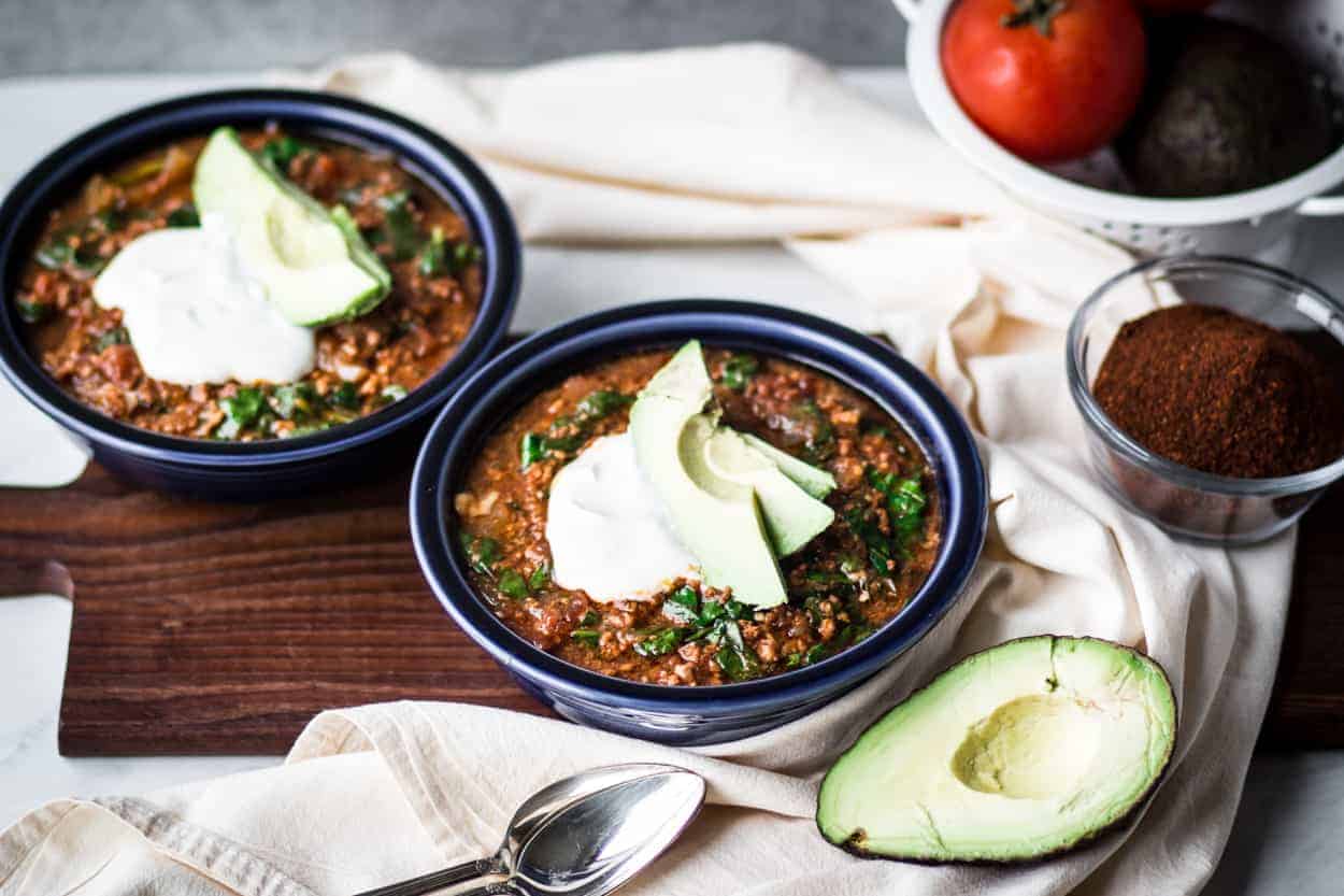 two bowls of gluten free instant pot taco soup with sour cream and avocado