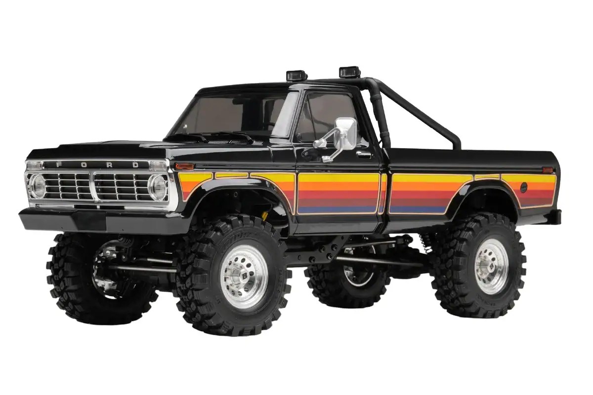 Detailed small-scale RC Ford pickup with rugged tires and retro design.