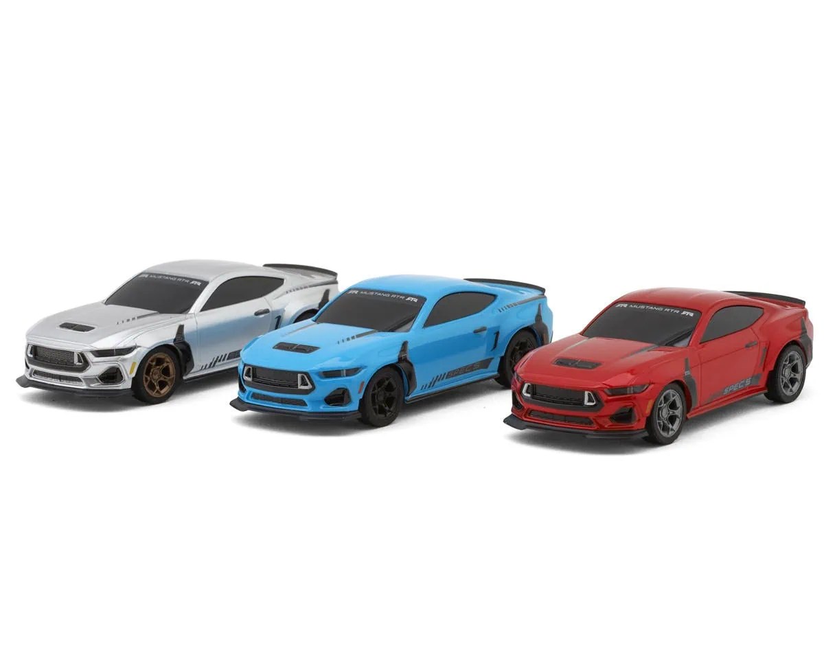Three small-scale RC cars in white, blue, and red on a white background.